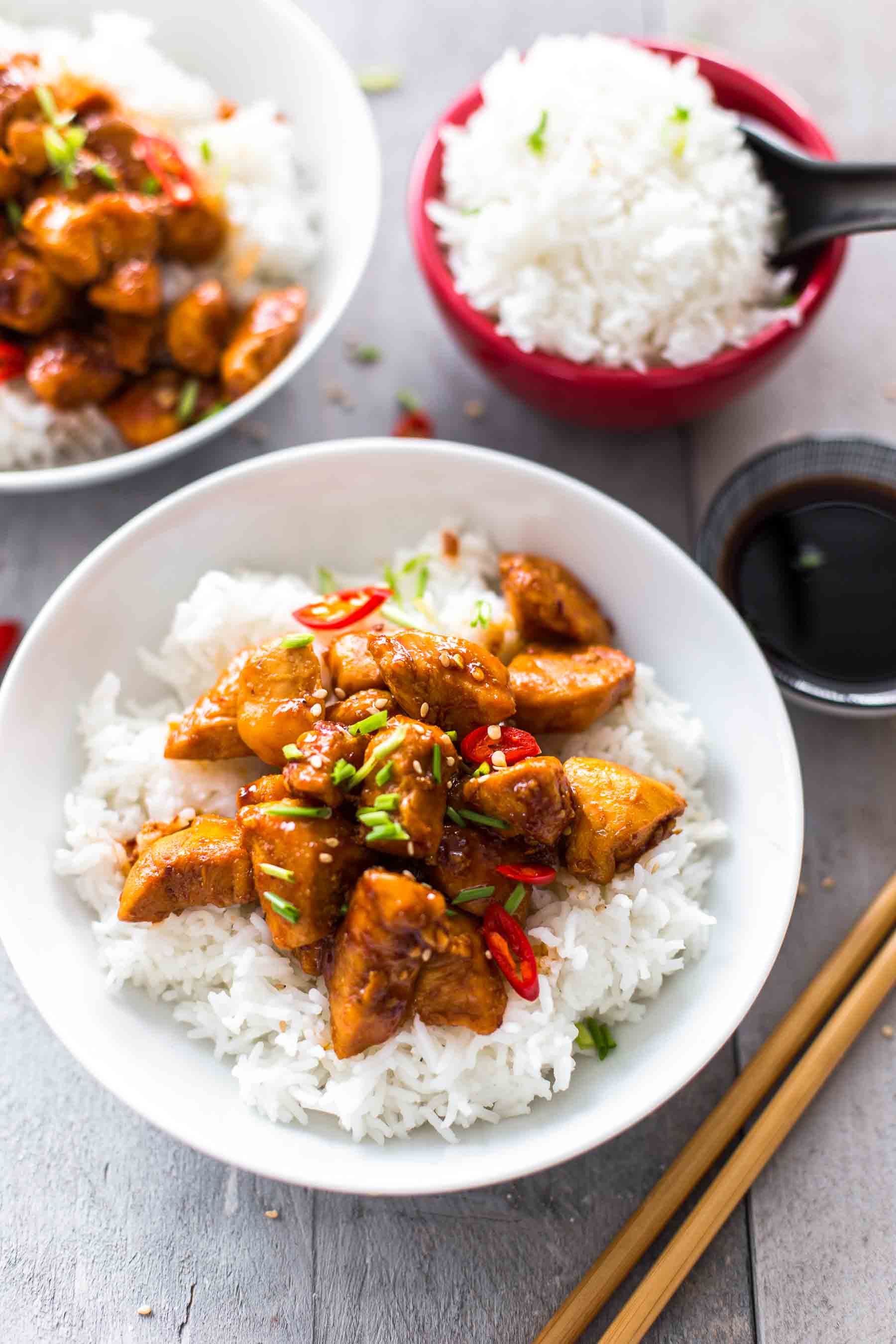 bowls of bourbon chicken with rice