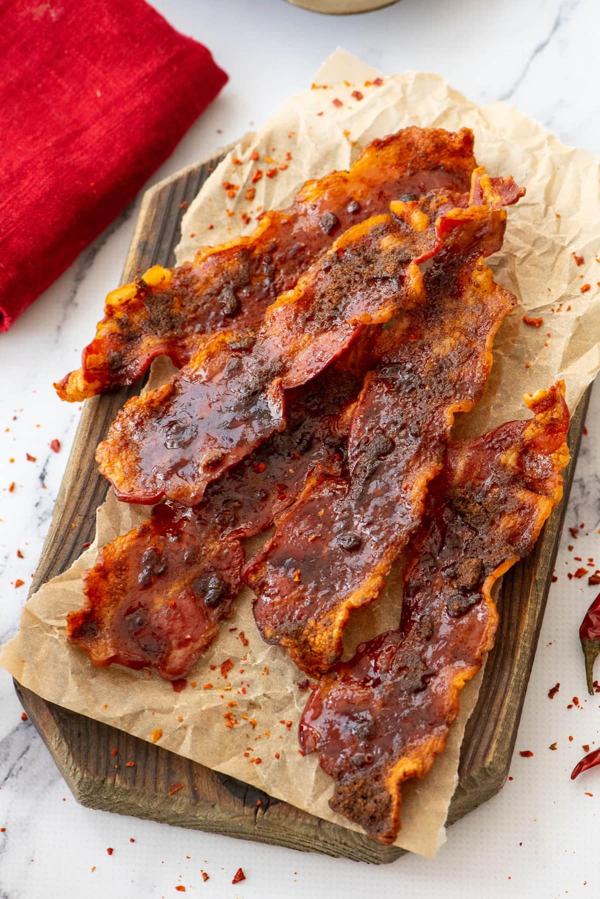 strips of bacon on a wood board