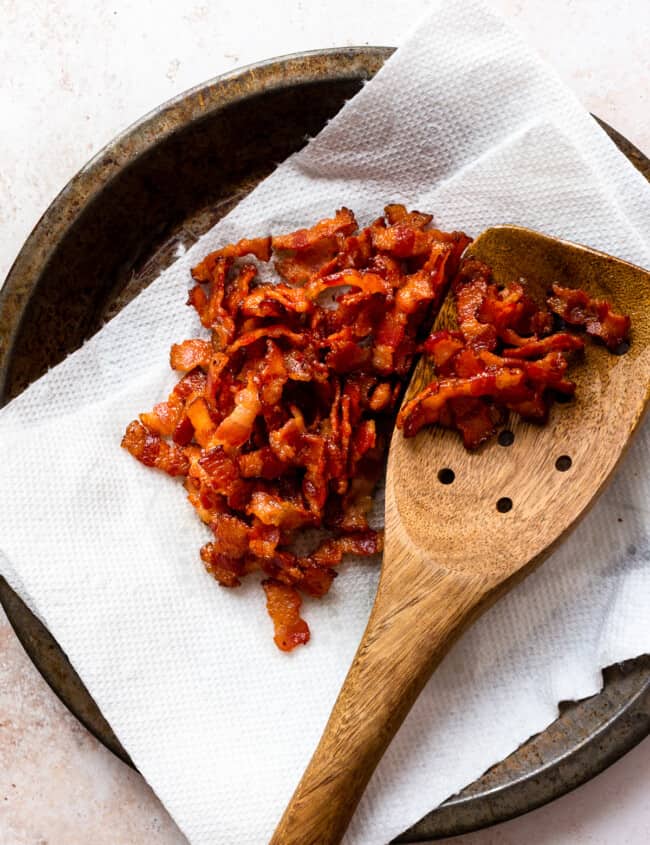 bacon crumbles with wooden spoon