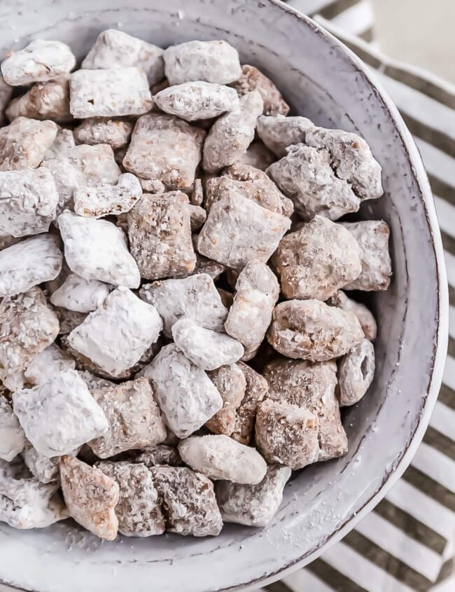 Puppy Chow is a chocolate-y treat that's sure to please! This easy puppy chow recipe includes an original version AND a mint chocolate puppy chow version. Find out how to make puppy chow for a simple yet delicious holiday treat!