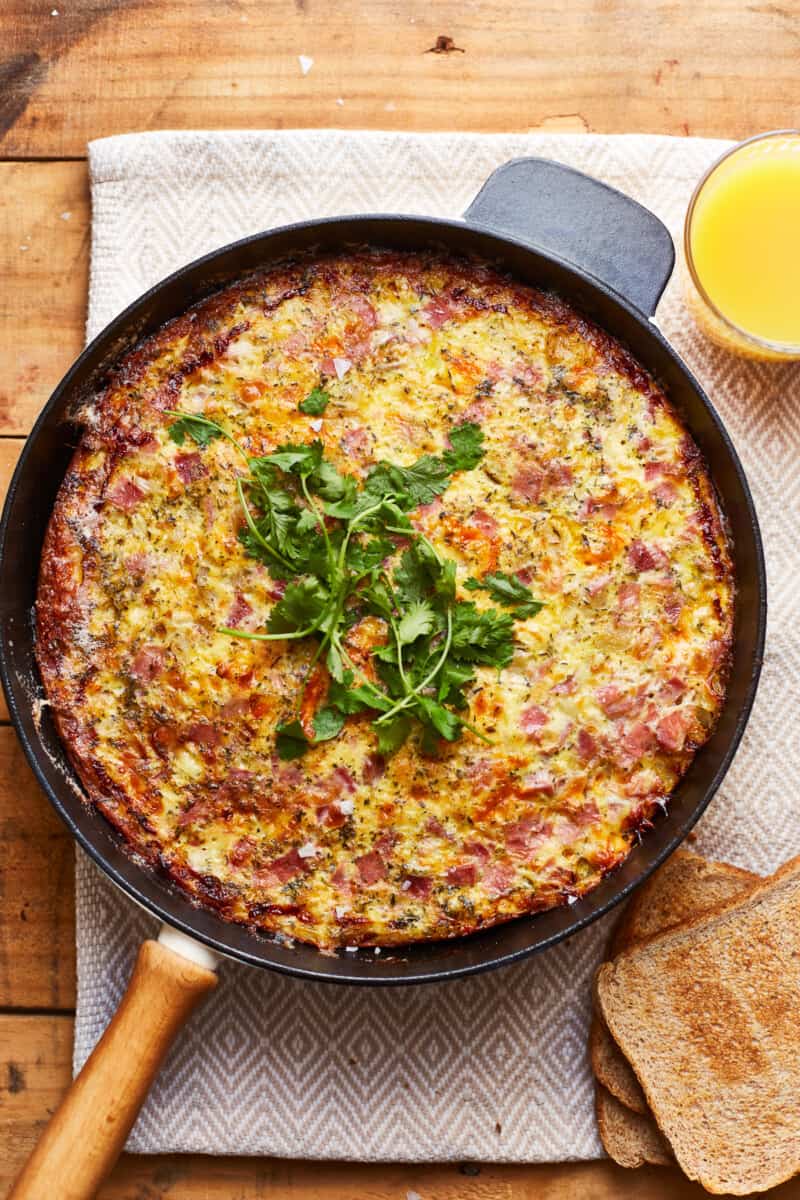 apple ham and cheese frittata in a skillet