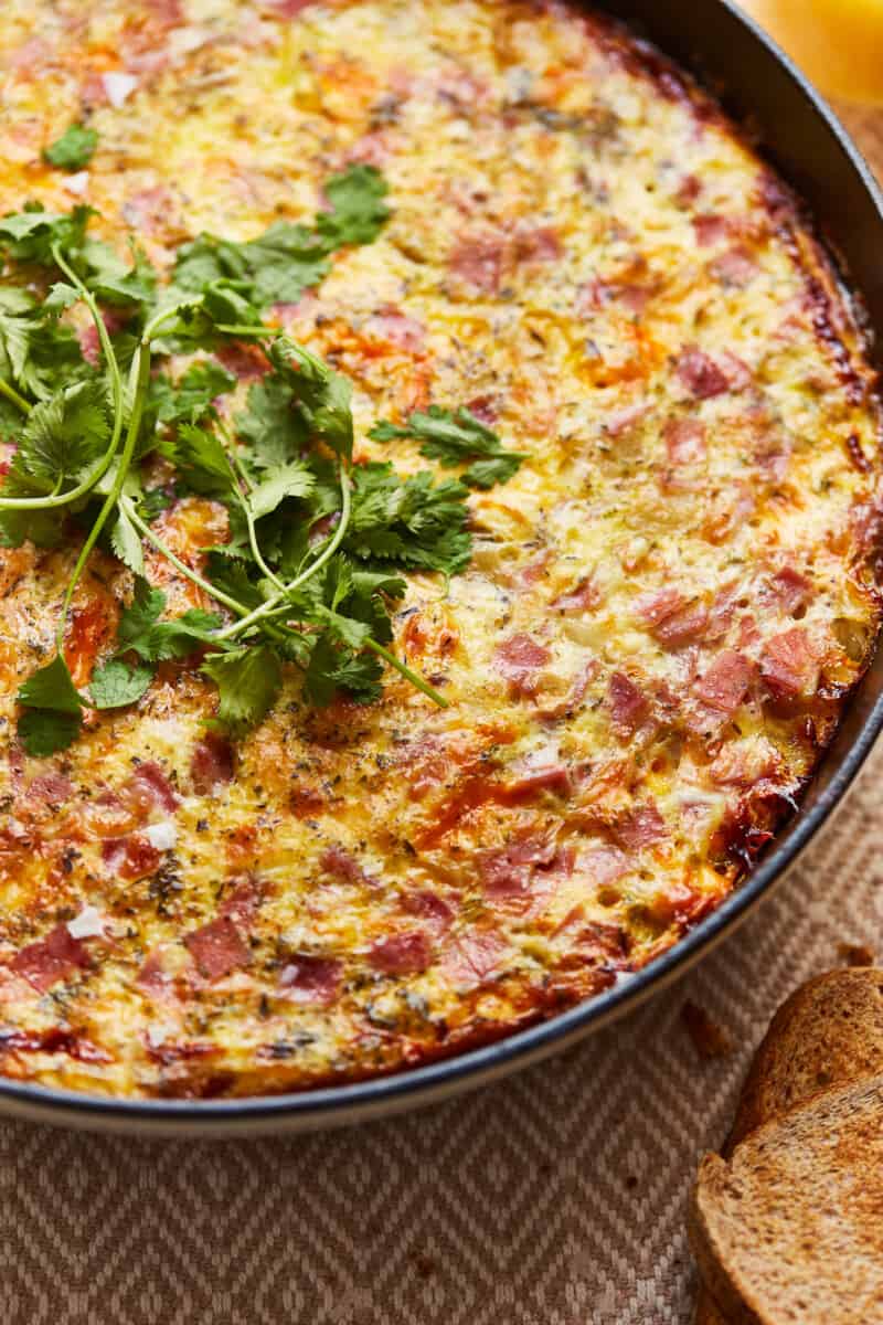 herbs on apple ham and cheese frittata