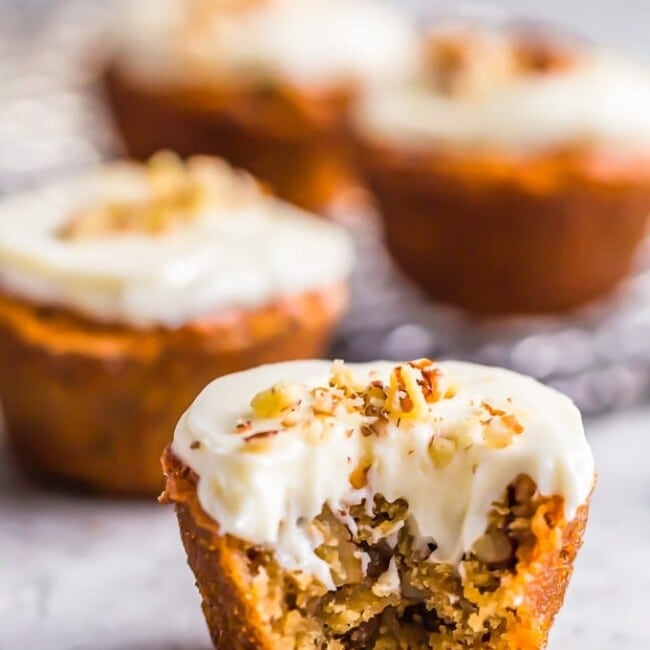 Pecan Pie Muffins are sure to brighten your morning! These tasty mini muffins are the perfect thing to eat for a quick breakfast, for a snack, or even as a fun dessert. They're so flavorful and taste just like pecan pie in muffin form. These breakfast muffins are so easy to make and taste even better with the cream cheese frosting!