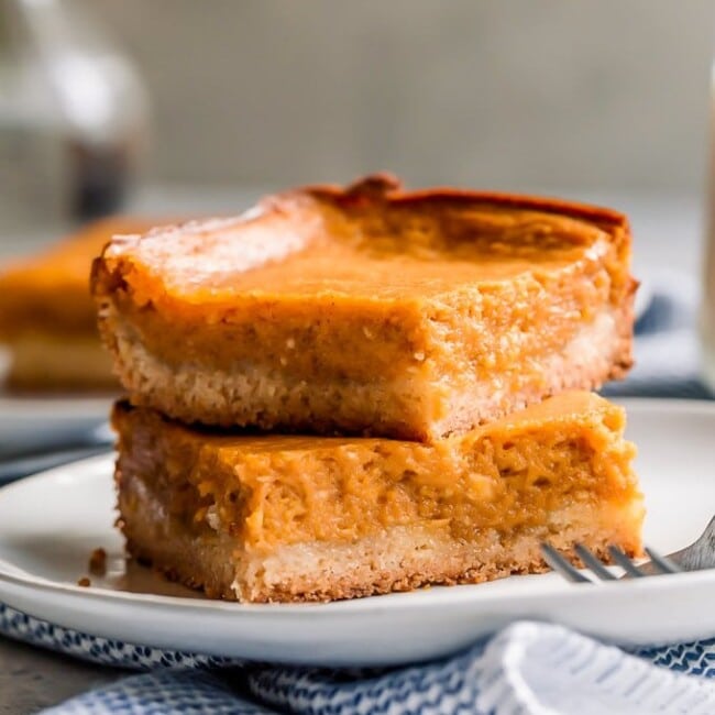 Pumpkin Gooey Butter Cake is a fall dessert recipe, but I like to make (and eat!) this ooey gooey cake year-round! If you don't know what gooey butter cake is, then you NEED to make this recipe ASAP. The combination of pumpkin and the gooey butter cake will blow your mind!