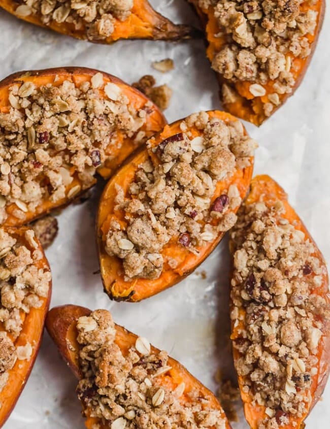 Twice Baked Sweet Potatoes are the perfect Thanksgiving sweet potato recipe! They're just like a regular twice baked potato, but they're topped with a pecan, cinnamon, oatmeal, and brown sugar mix to complement the natural sweetness. You'll definitely want this tasty sweet potato side dish on your holiday table!