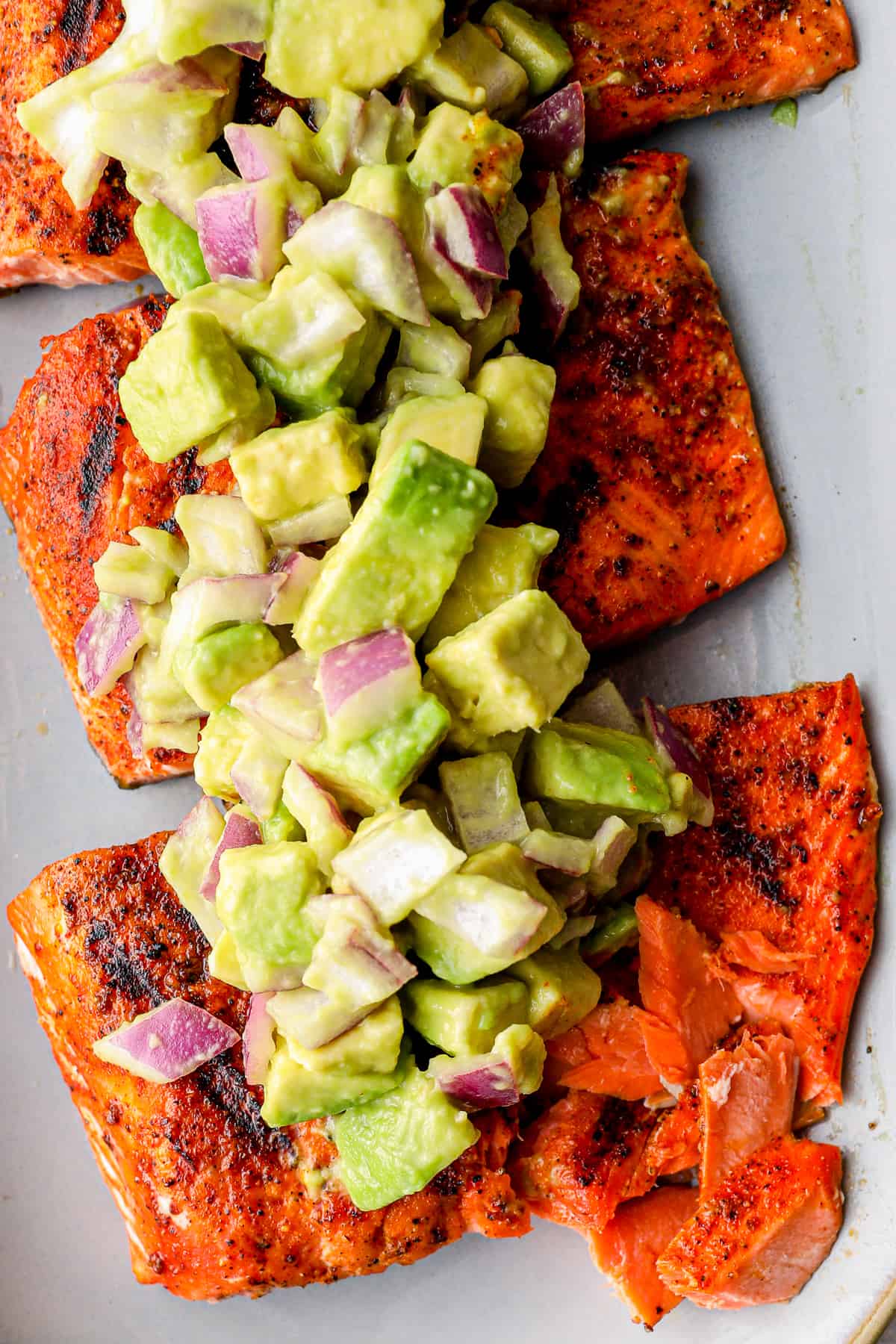 platter of grilled salmon with avocado salsa