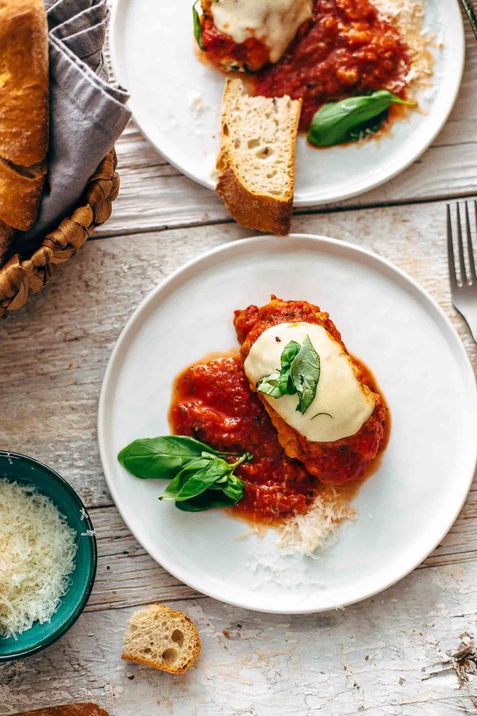 Plates of mozzarella chicken and bread