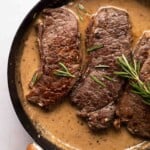 garlic rosemary steak in a skillet