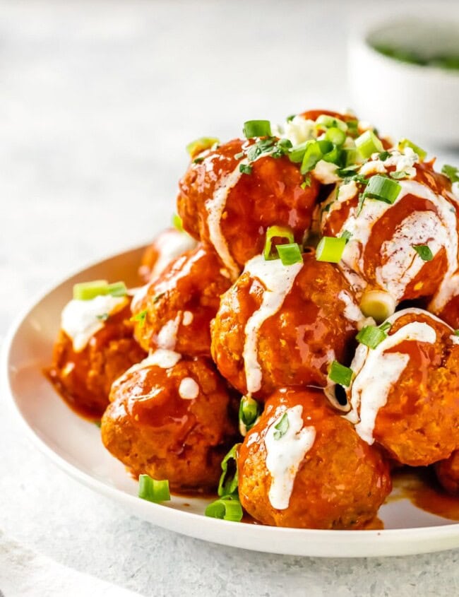 Buffalo Chicken Meatballs are one of our very favorite party appetizers. These Blue Cheese Stuffed Meatballs are relatively healthy, SO flavorful, and sure to please. If you're not sure what to serve for your next tailgating party, this Buffalo Chicken Meatballs Recipe is just the thing. Serve with Homemade Ranch!