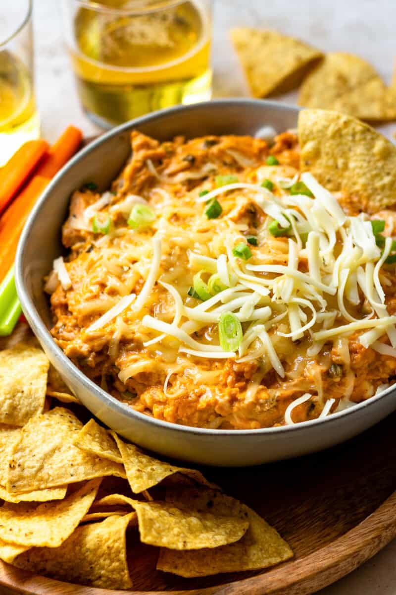 crockpot bbq chicken dip in gray bowl with cheese