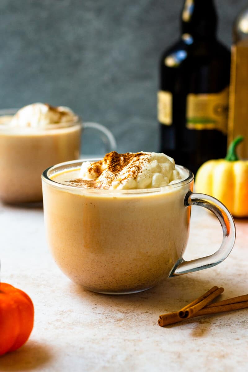 hot pumpkin cocktail in mug with whipped cream