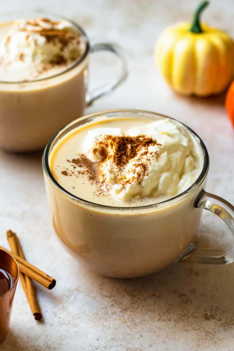 hot pumpkin cocktail in mug with whipped cream