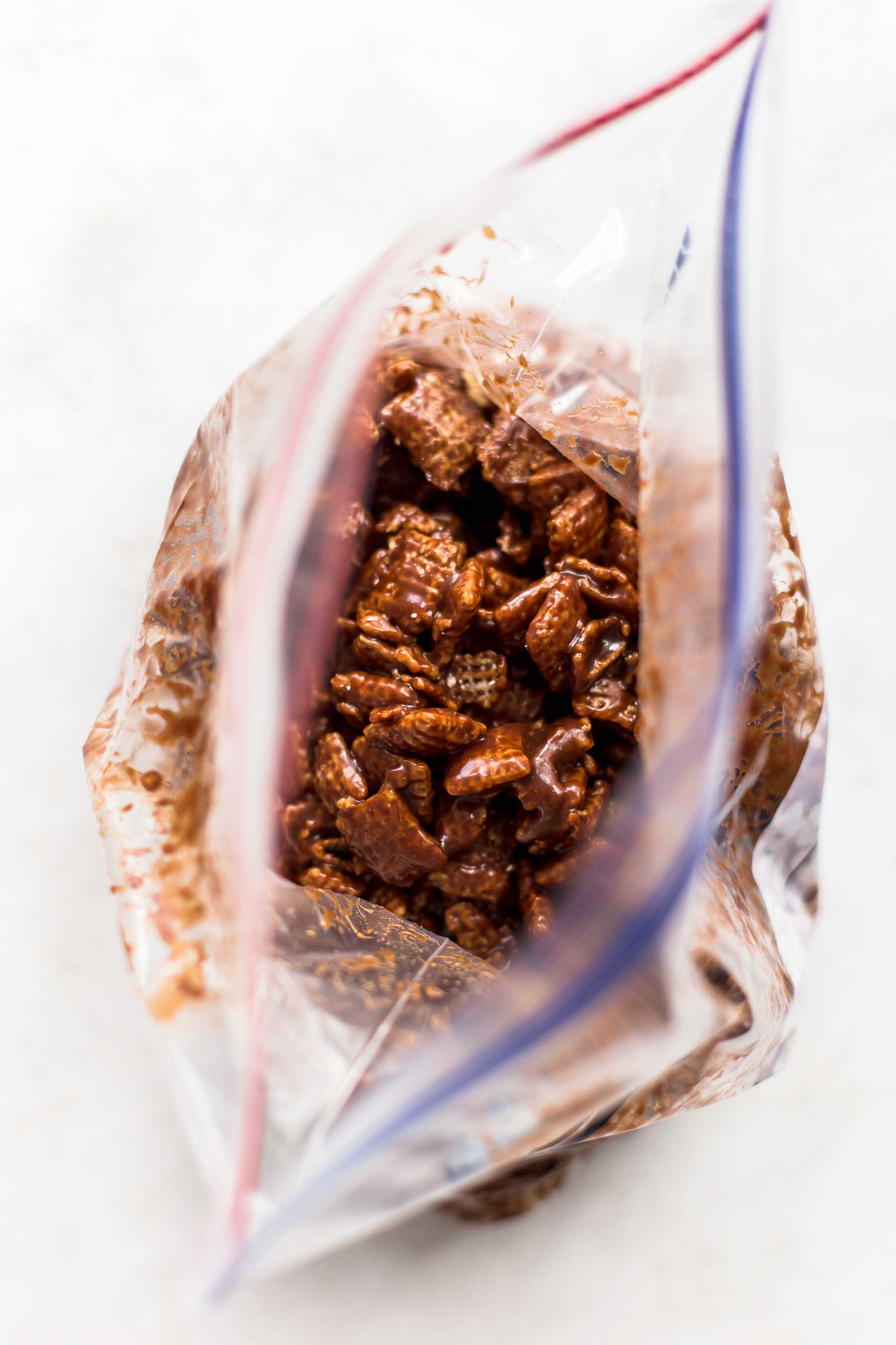 chocolate coated chex cereal in a ziploc bag