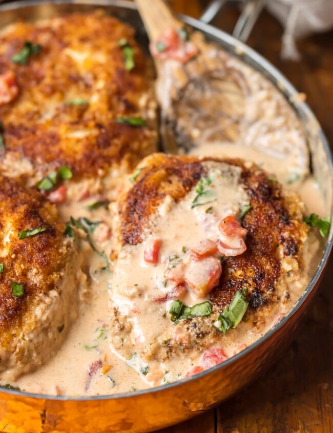 Basil Chicken with Cream Sauce has always been one of my favorite recipes. This Basil Chicken Recipe has a creamy sauce made with buttermilk and cheese that is just to die for. Easy breaded chicken, tomatoes, fresh herbs, and more make up this super easy, delicious, and fool-proof Skillet Chicken Recipe. You need this Cream Chicken in your life ASAP!