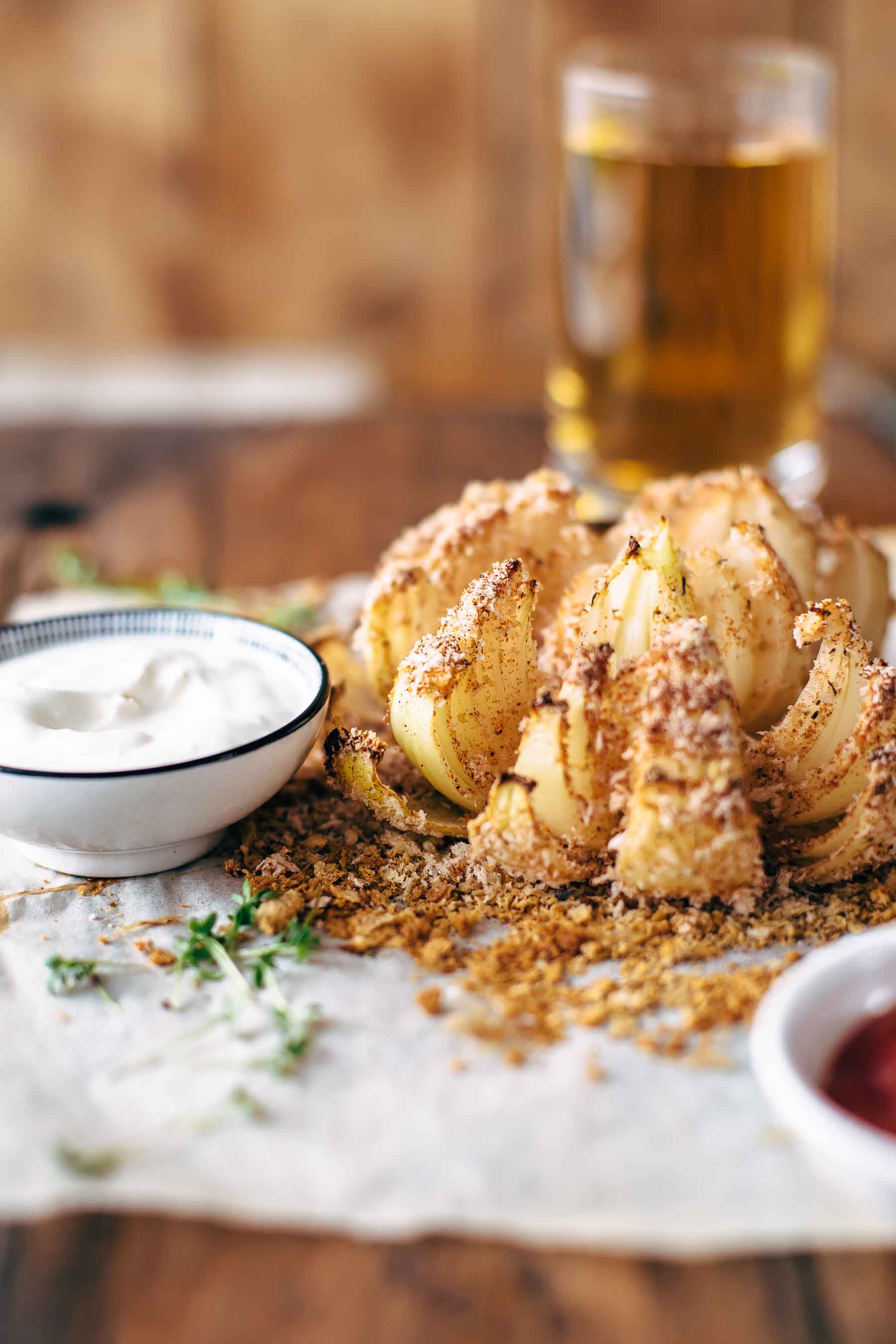 picture of baked blooming onion with dipping sauces