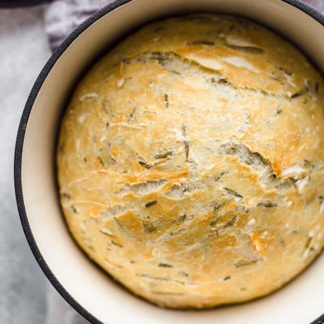 Dutch Oven Bread is such a simple way to make homemade bread. Making no knead bread in a dutch oven is just so easy, it's completely changed the way I think about baking bread! This Rosemary Bread with Sea Salt is simply perfect & tastes amazing. If you're looking for an easy bread recipe, this is it!