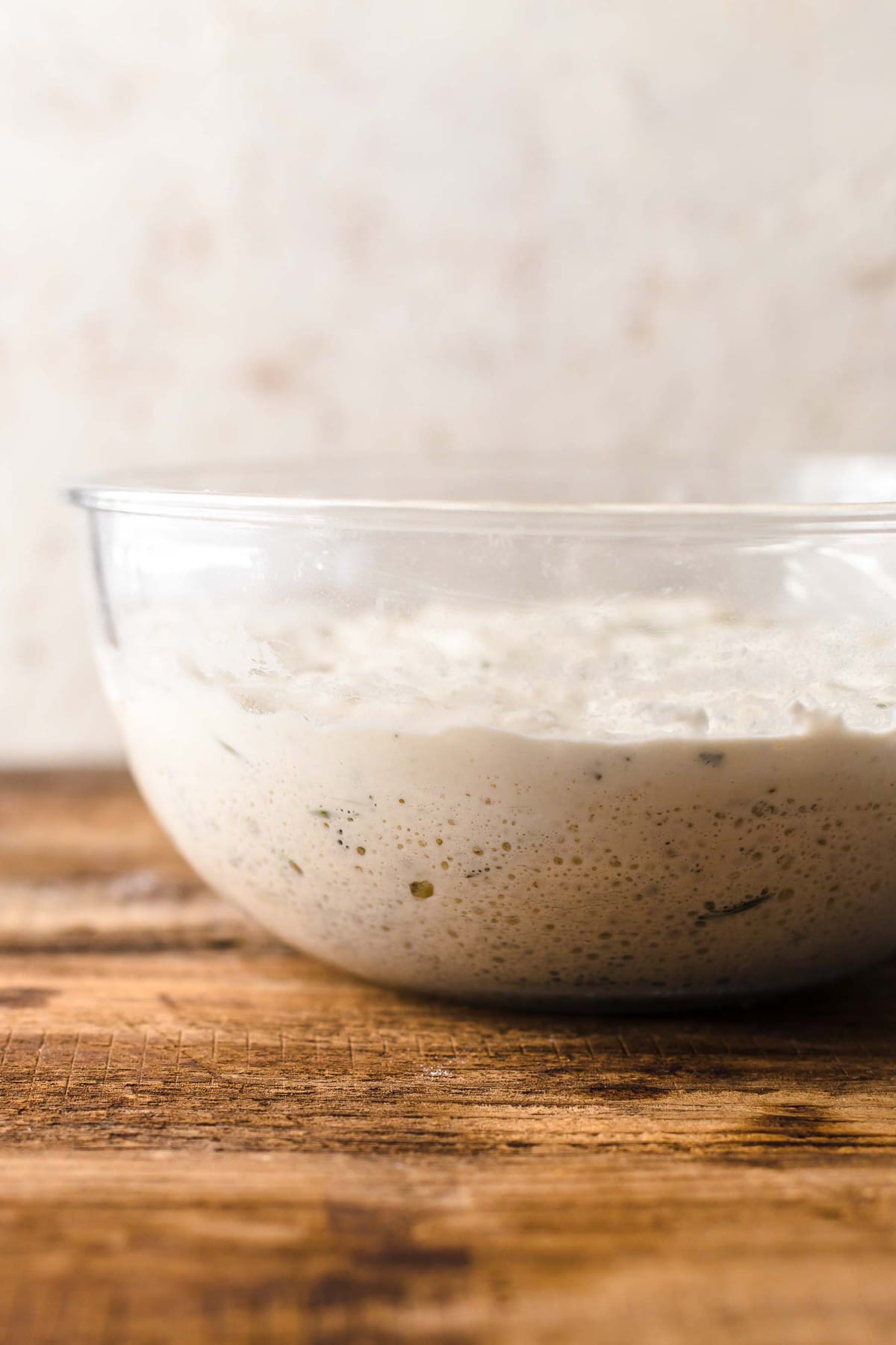 bubbly dough in a glass bowl.