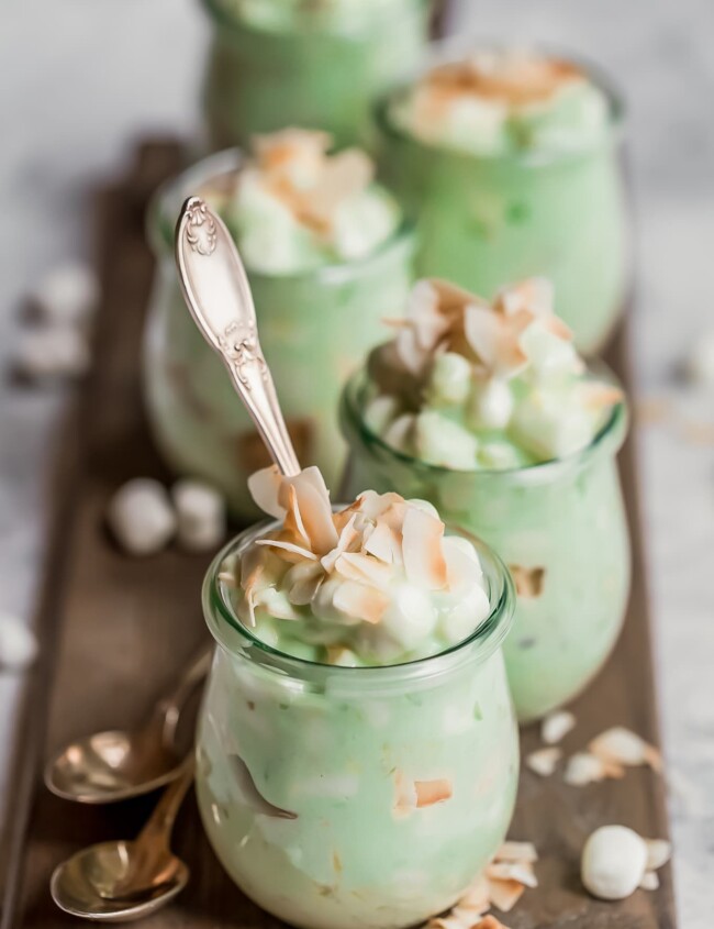 Watergate Salad is the perfect Easter side dish! Also known as Pistachio Fluff, this Watergate Salad recipe is fluffy and delicious. Grab a spoon because this classic dessert recipe has a place at every table, especially holiday tables!