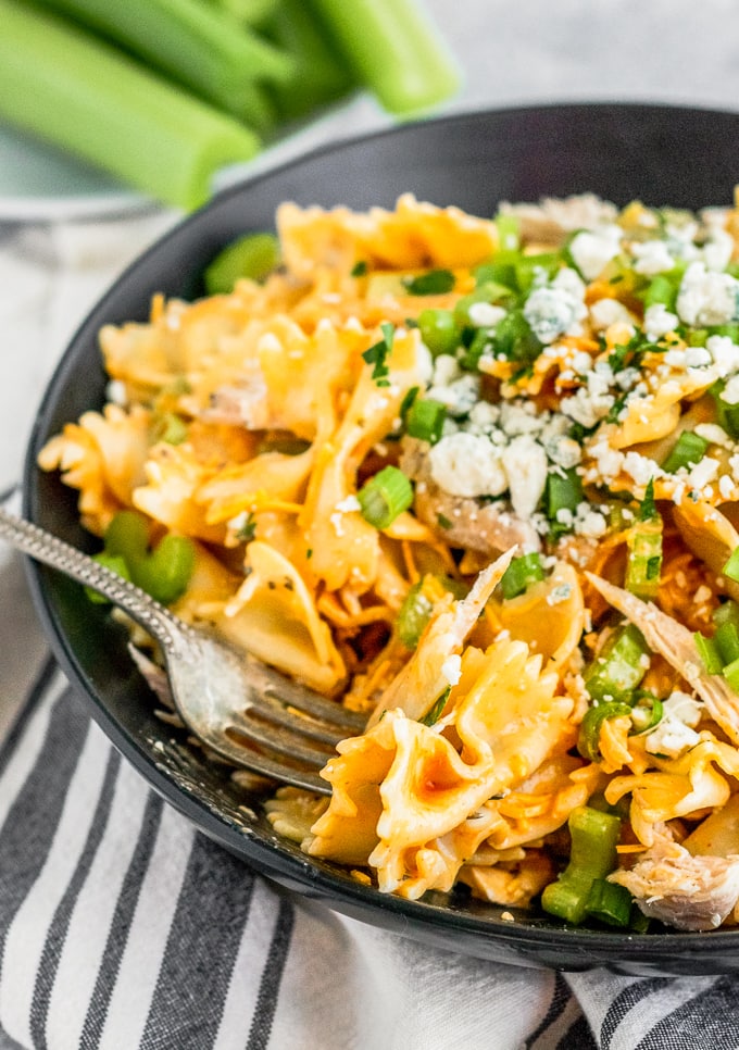 fork digging into buffalo chicken pasta salad