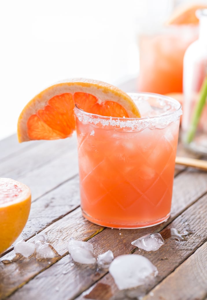 close up of grapefruit salty dog on a table with ice