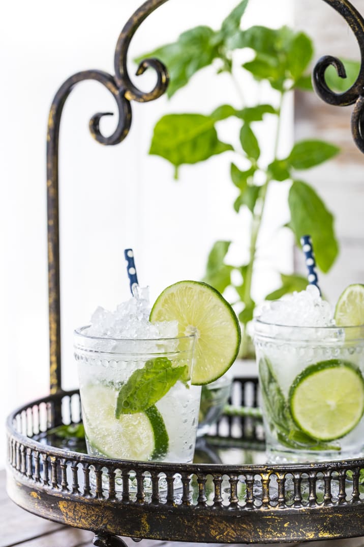 two italian mojitos on a black tray