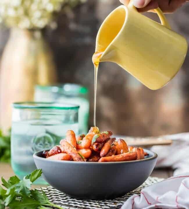 glaze poured over bowl of roasted carrots