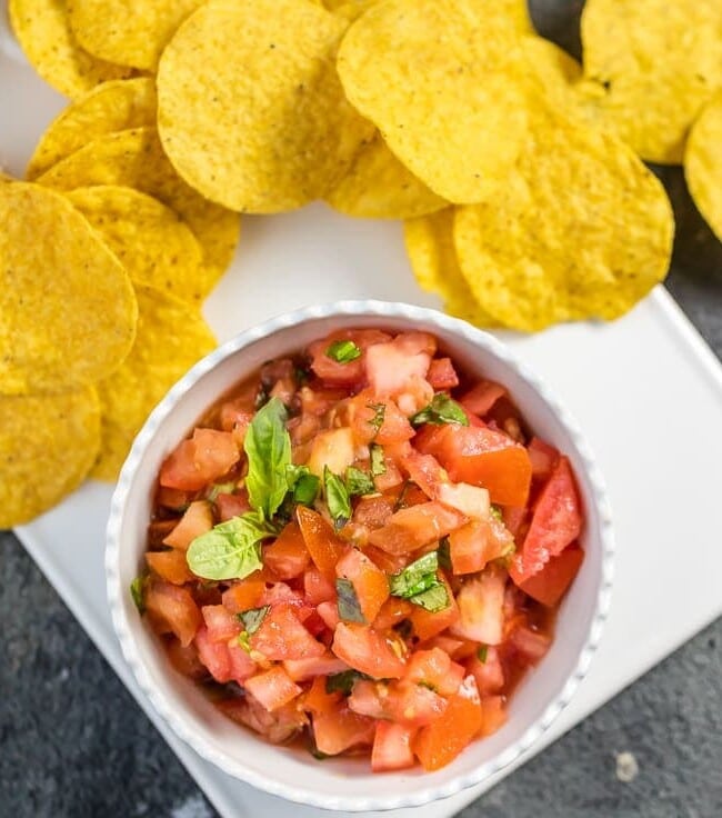 This EASY Italian Salsa only has 5 ingredients! Love these flavors as a dip or bruschetta topper. Simple to throw together and gone in minutes! Favorite easy salsa recipe!