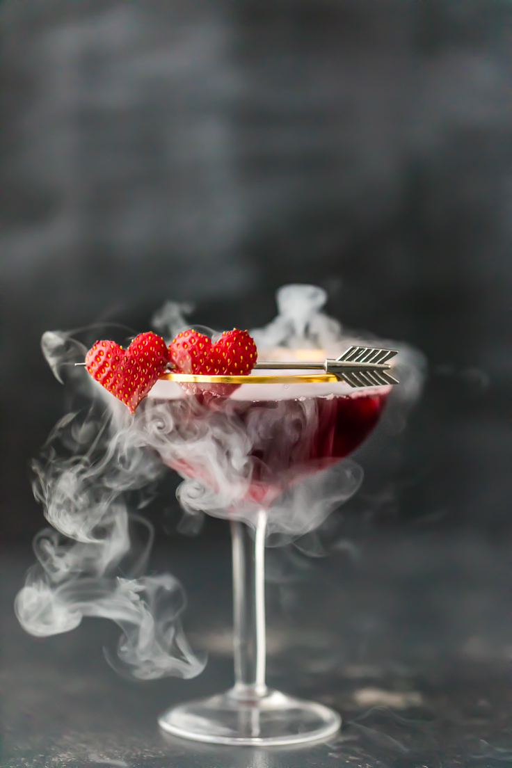 pomegranate martini with dry ice smoking out