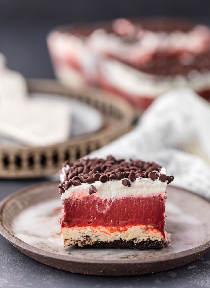 a piece of red velvet dessert lasagna on a small plate