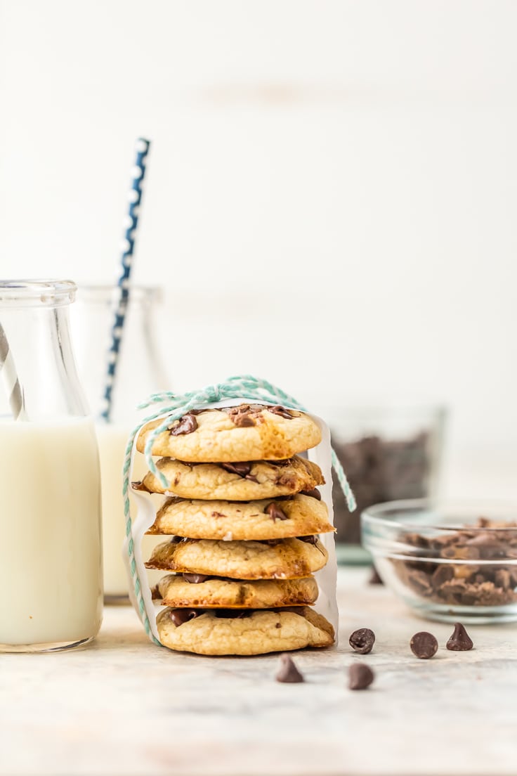 stack of cookies with glass of milk