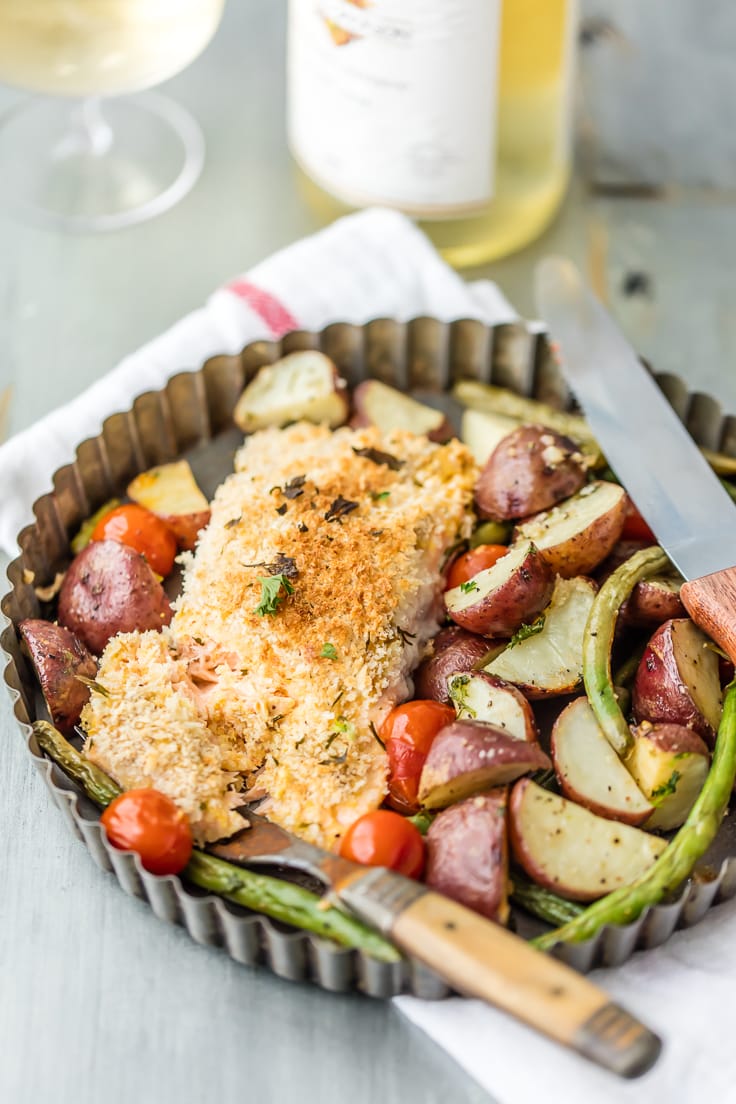 a plate of baked salmon and potatoes