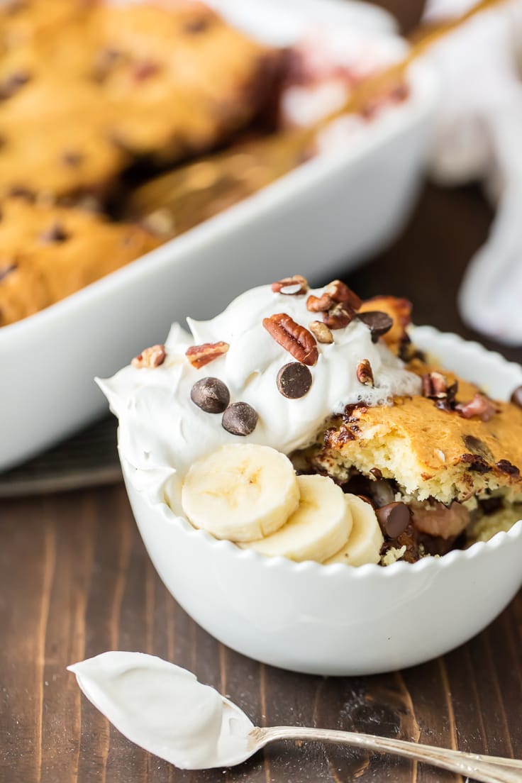 a bowl of cake topped with whipped cream