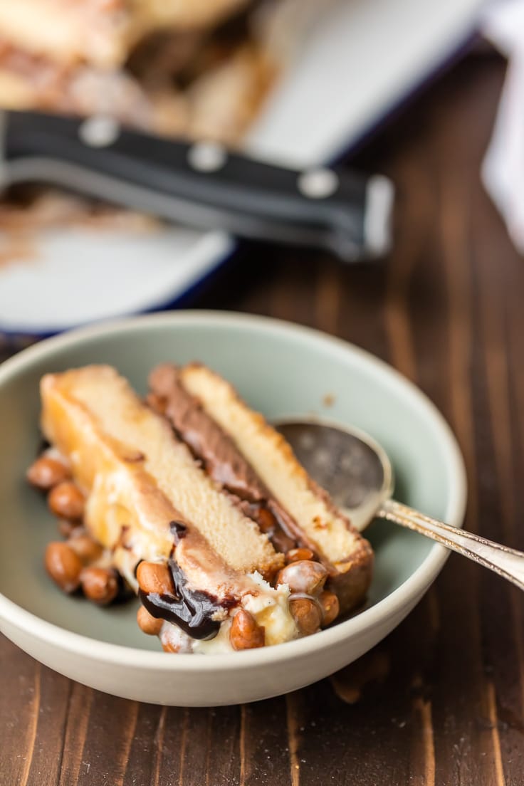 a slice of snickers ice cream cake in a bowl