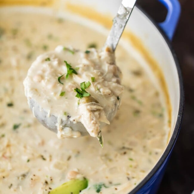 CREAMY WHITE CHICKEN CHILI made with CREAM CHEESE is the ultimate comfort food! Made in minutes and feeds up to 16 people! Freeze some for a delicious meal later. THE BEST WHITE CHICKEN CHILI EVER!