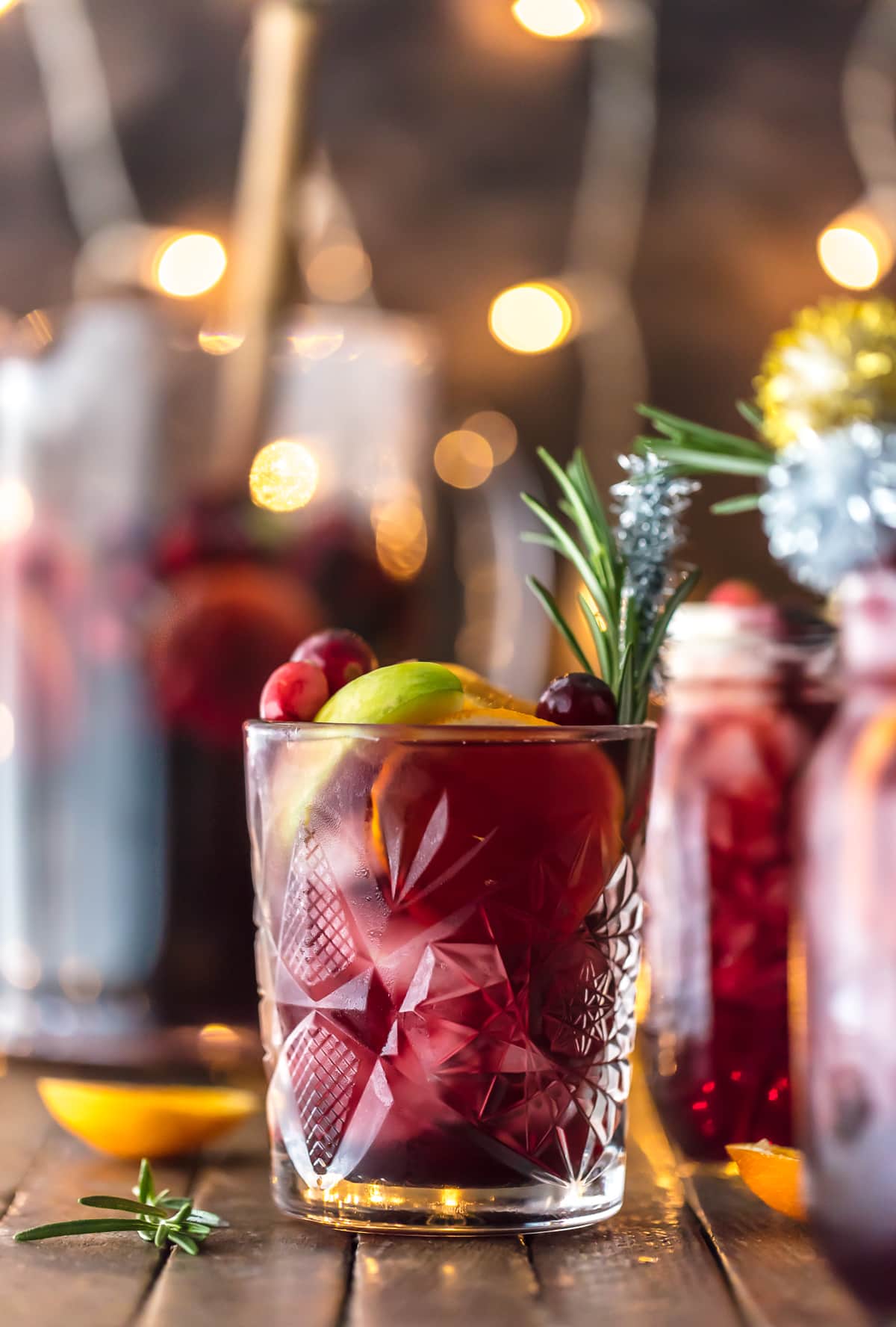 EASY HOLIDAY SANGRIA (GLUTEN FREE!) is the perfect Christmas cocktail! Made with red wine, vodka, sparkling apple cider, and several juices; you'll be the star of any holiday party. Cheers!