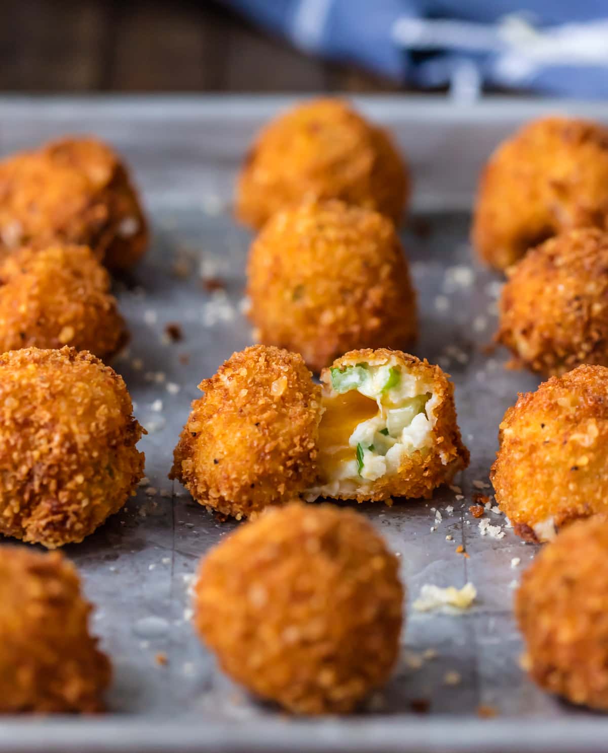 Deep Fried Mashed Potato Bites lined up on a baking sheet