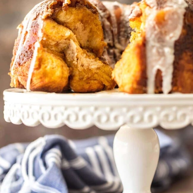 pumpkin pie monkey bread on a white cake stand