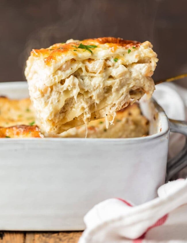 seafood lasagna coming out of baking dish