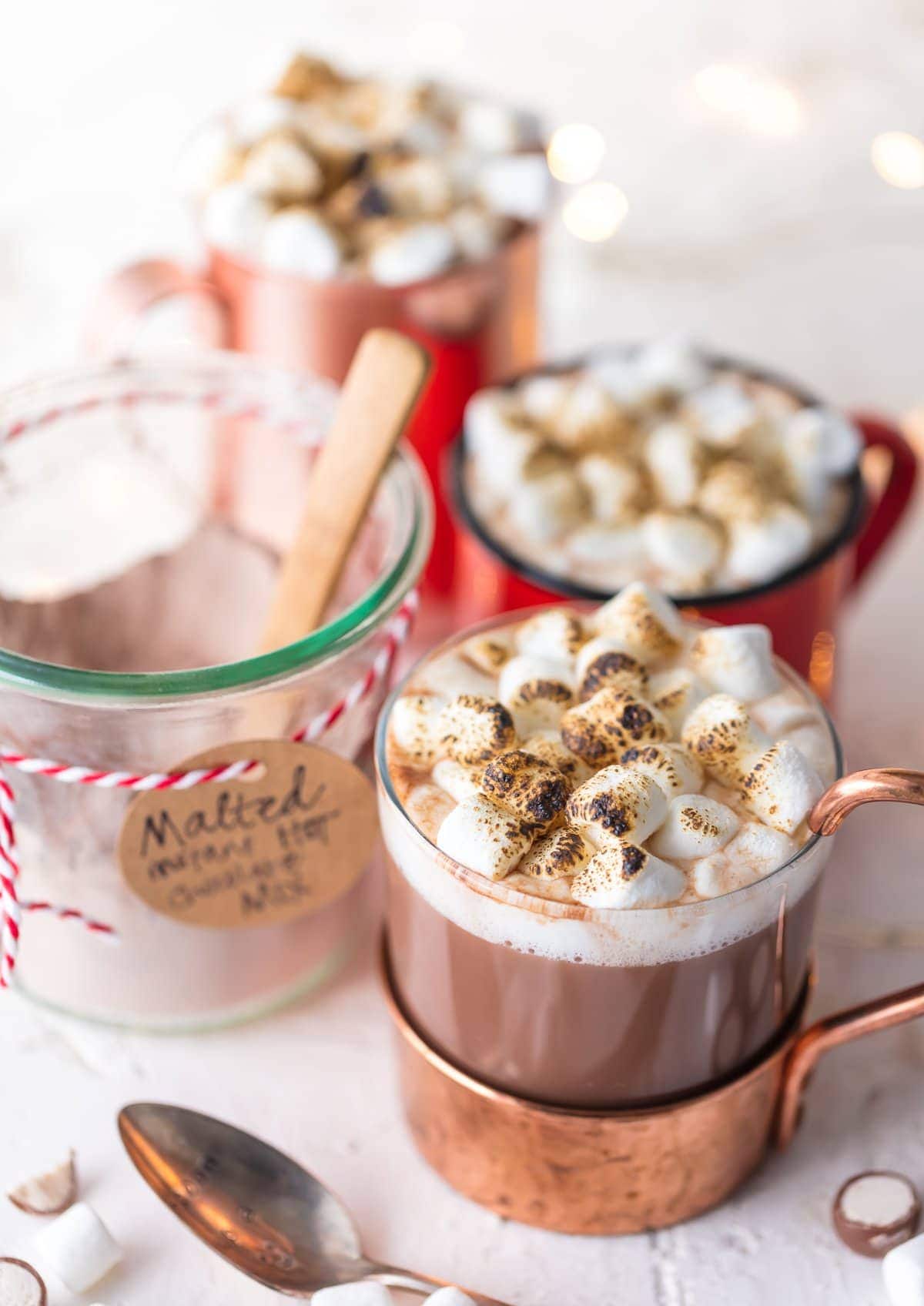 Three mugs of malted hot cocoa 