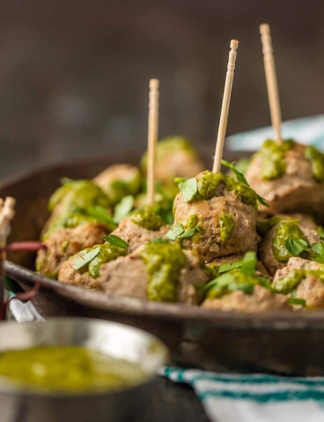 These PERUVIAN CHICKEN MEATBALLS WITH GREEN SAUCE are the perfect holiday or Super Bowl appetizer! The Peruvian green sauce, made with a parsley base, is just the right amount of spicy. The drop meatballs are just the right amount of easy.