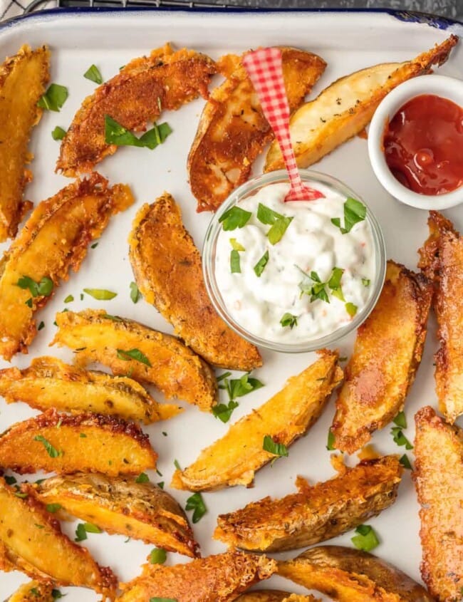 These CRISPY PARMESAN POTATO WEDGES are so absolutely delicious and EASY! You'll never go back to regular fries after you try these thick potato wedges coated in a crispy cheese shell. Just too good!