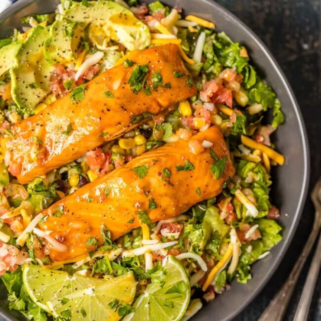 over the top view of salmon on a bed of salad