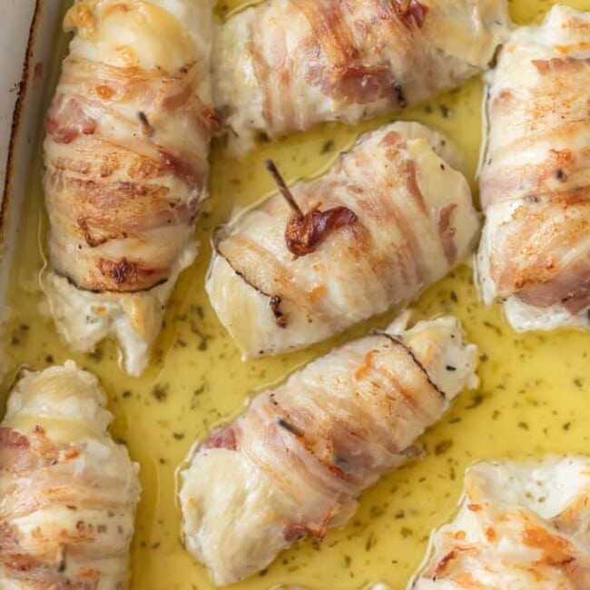 These CHEESY PANCETTA WRAPPED CHICKEN ROLLUPS are so quick and easy and delicious! Chicken stuffed with boursin cheese and wrapped in pancetta makes for the most moist and delicious chicken ever.