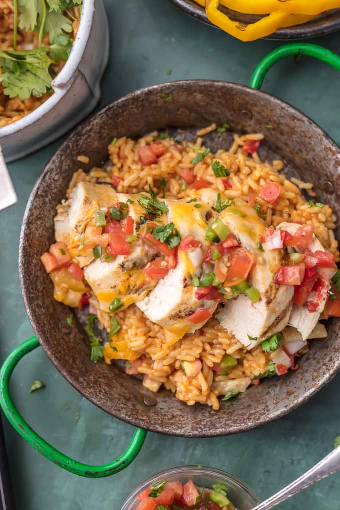 top view of chicken breast and rice on pan