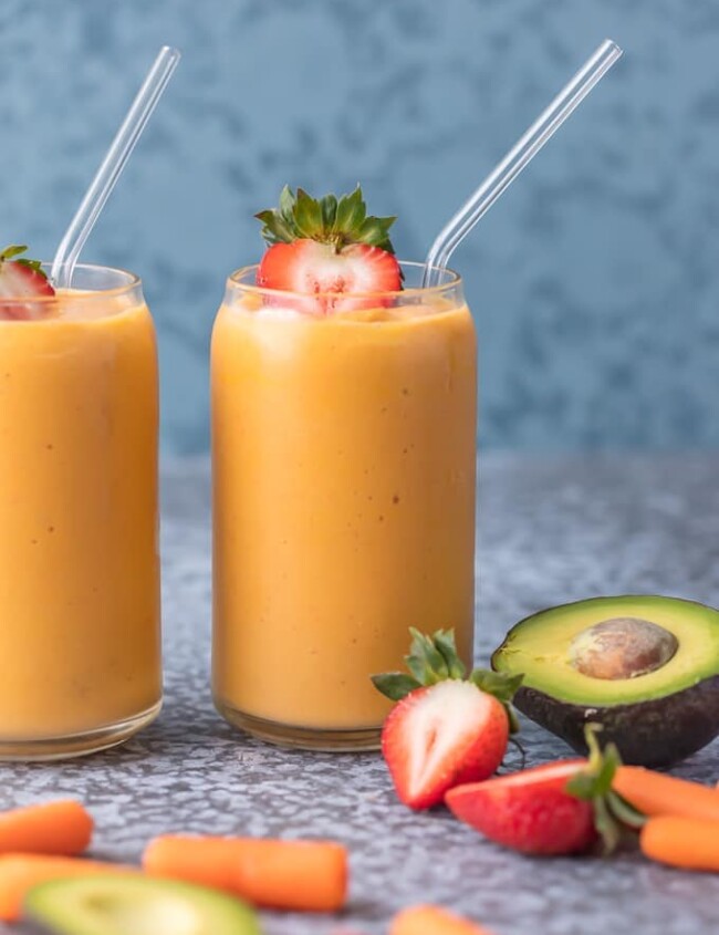 This Coconut Water Smoothie is full of delicious ingredients like coconut water, strawberries, mangoes, carrots, and avocado! Sip your way to beautiful skin with this healthy smoothie recipe!