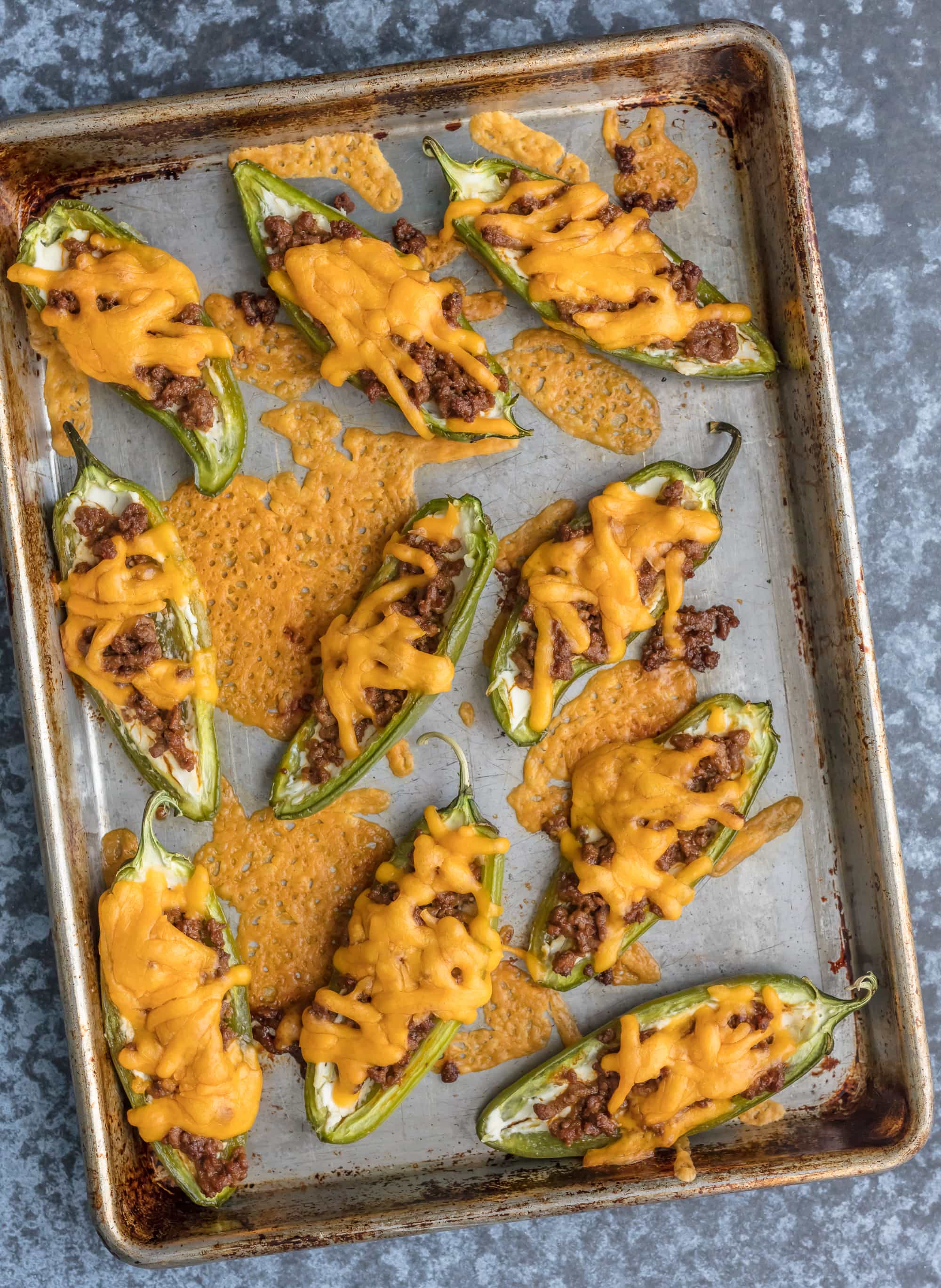 Cheeseburger Stuffed Jalapeno Poppers recipe on a baking tray