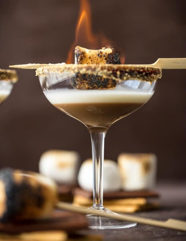 toasted smores martinis with a marshmallow on fire