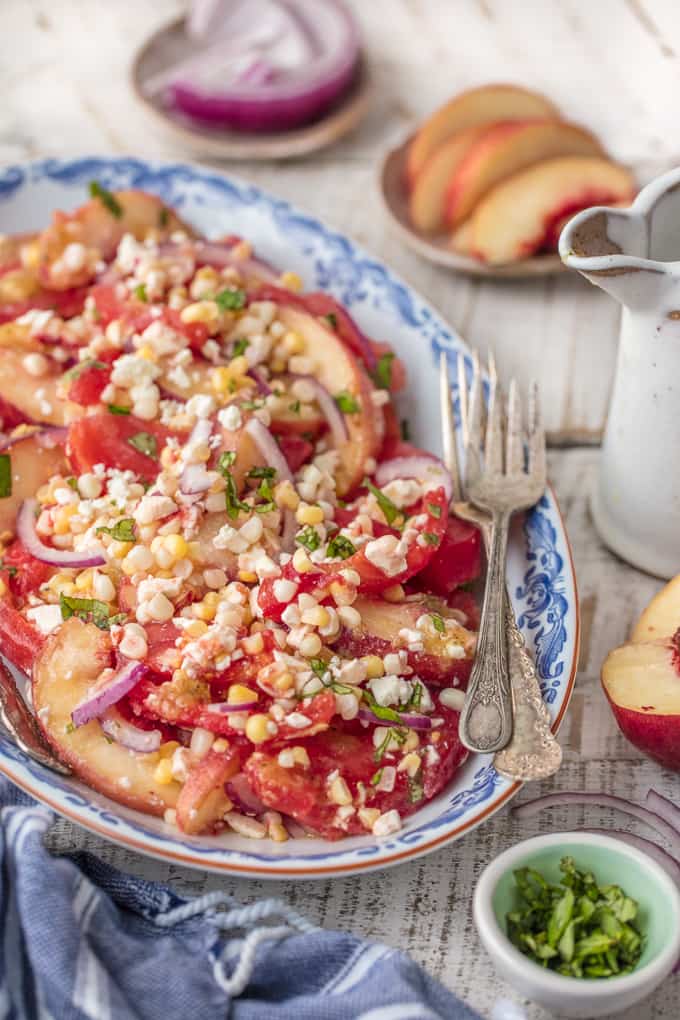 Corn, tomato, onion, feta, peach salad with spicy honey vinaigrette 