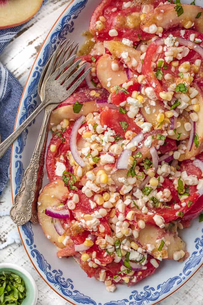 Peach Corn Tomato Salad on a serving platter