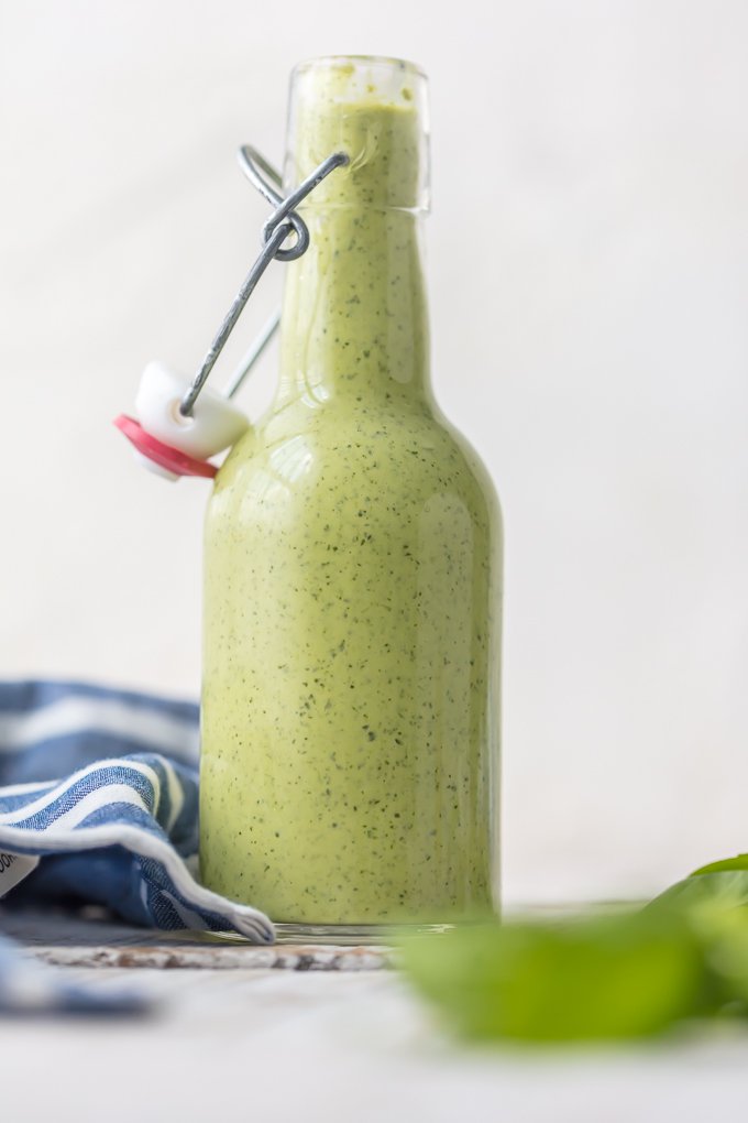 Glass bottle full of green Aji sauce